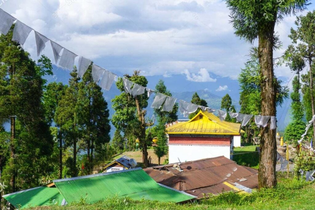 Buddhist monastery in Yuksom Sikkim with prayer flags and mountain views